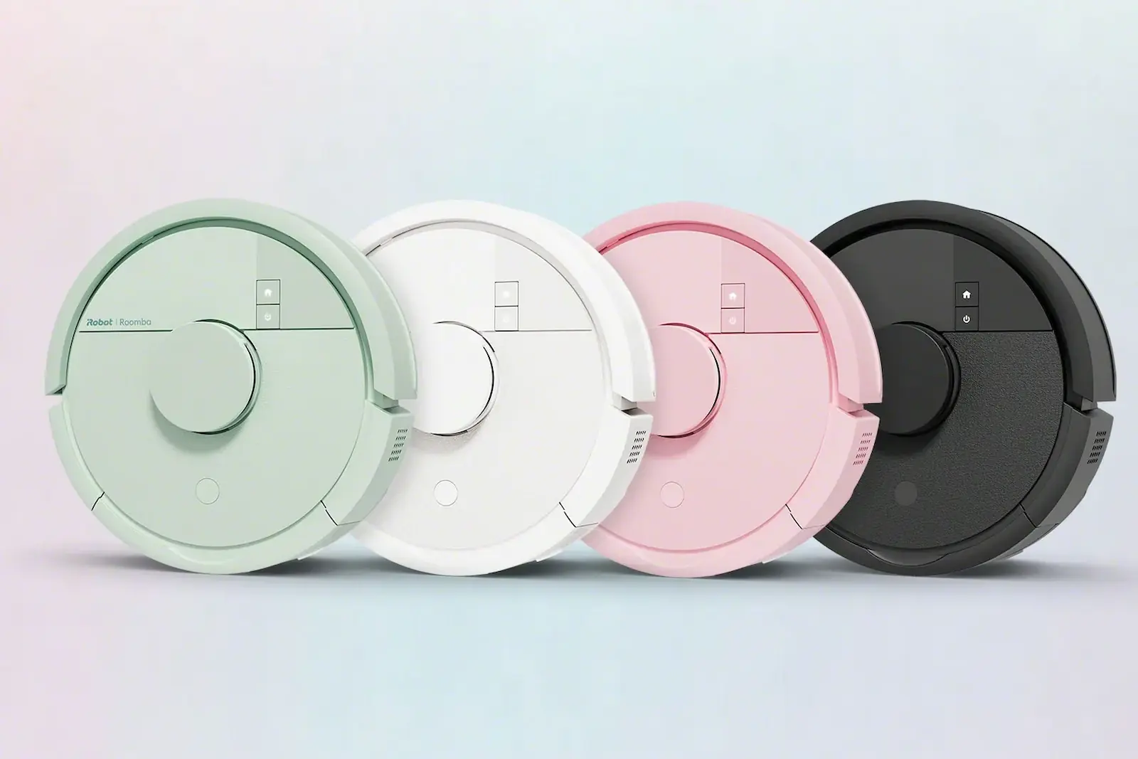 Cuatro modelos de la mini Roomba de iRobot en verde, blanco, rosa y negro