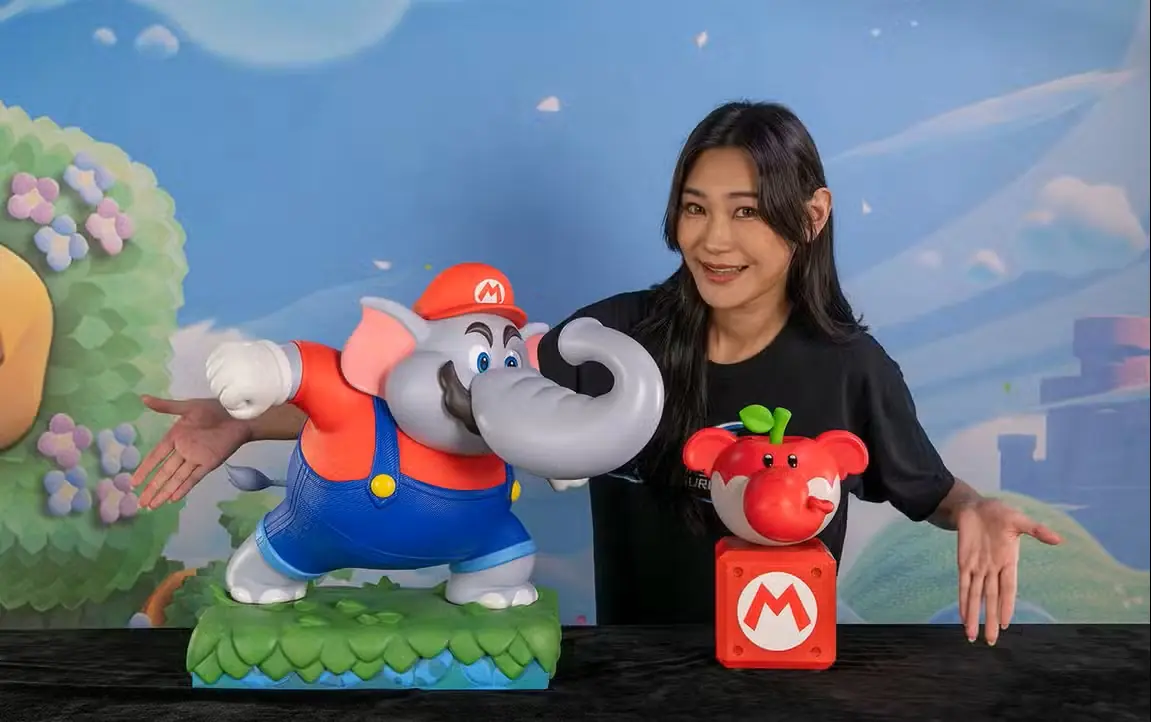 Detalle de la estatua de Mario Elefante junto a la Fruta Elefante de Super Mario Bros. Wonder