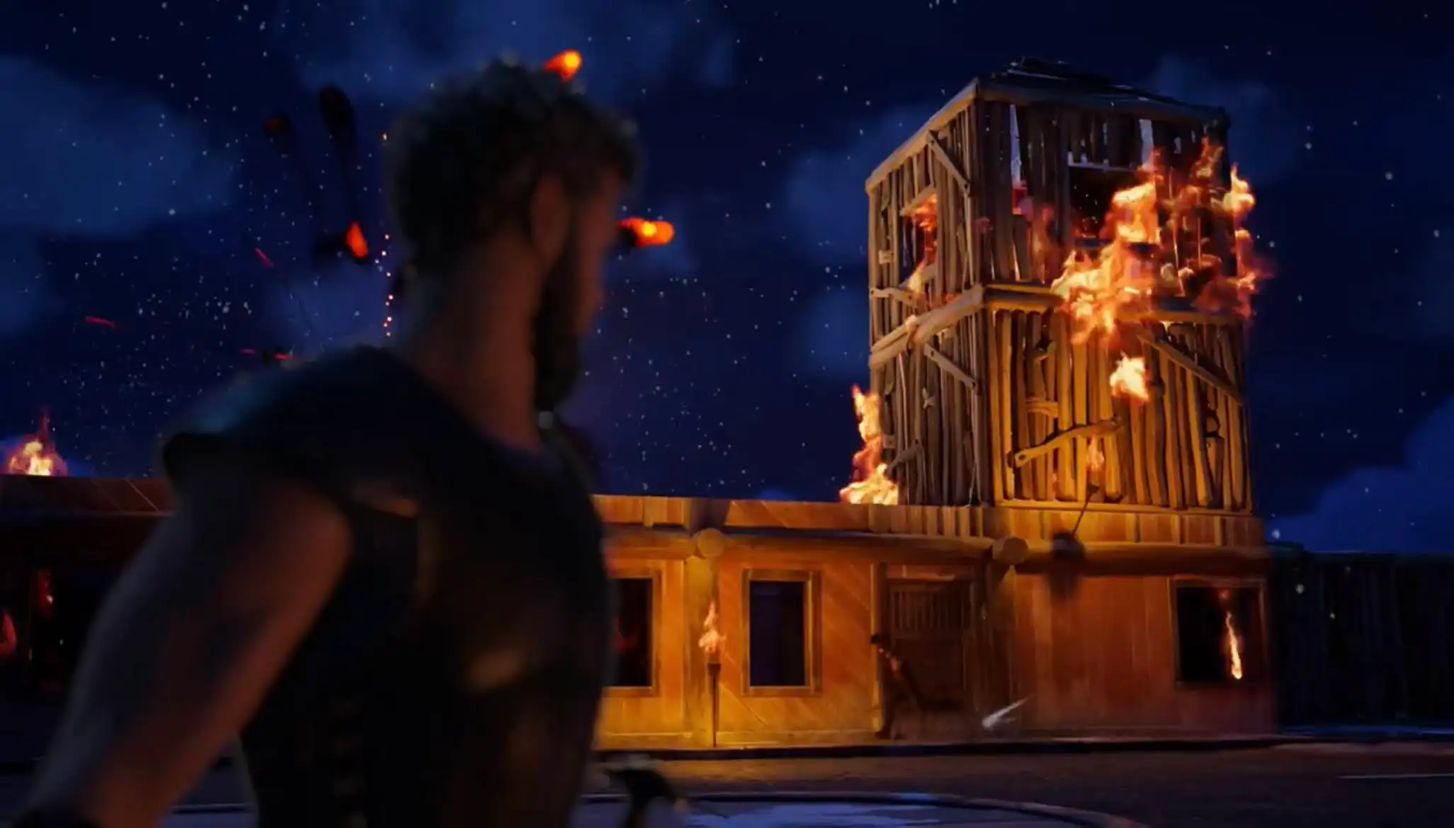 Escena de la colaboración de Fortnite con La Odisea: un guerrero frente a una torre en llamas