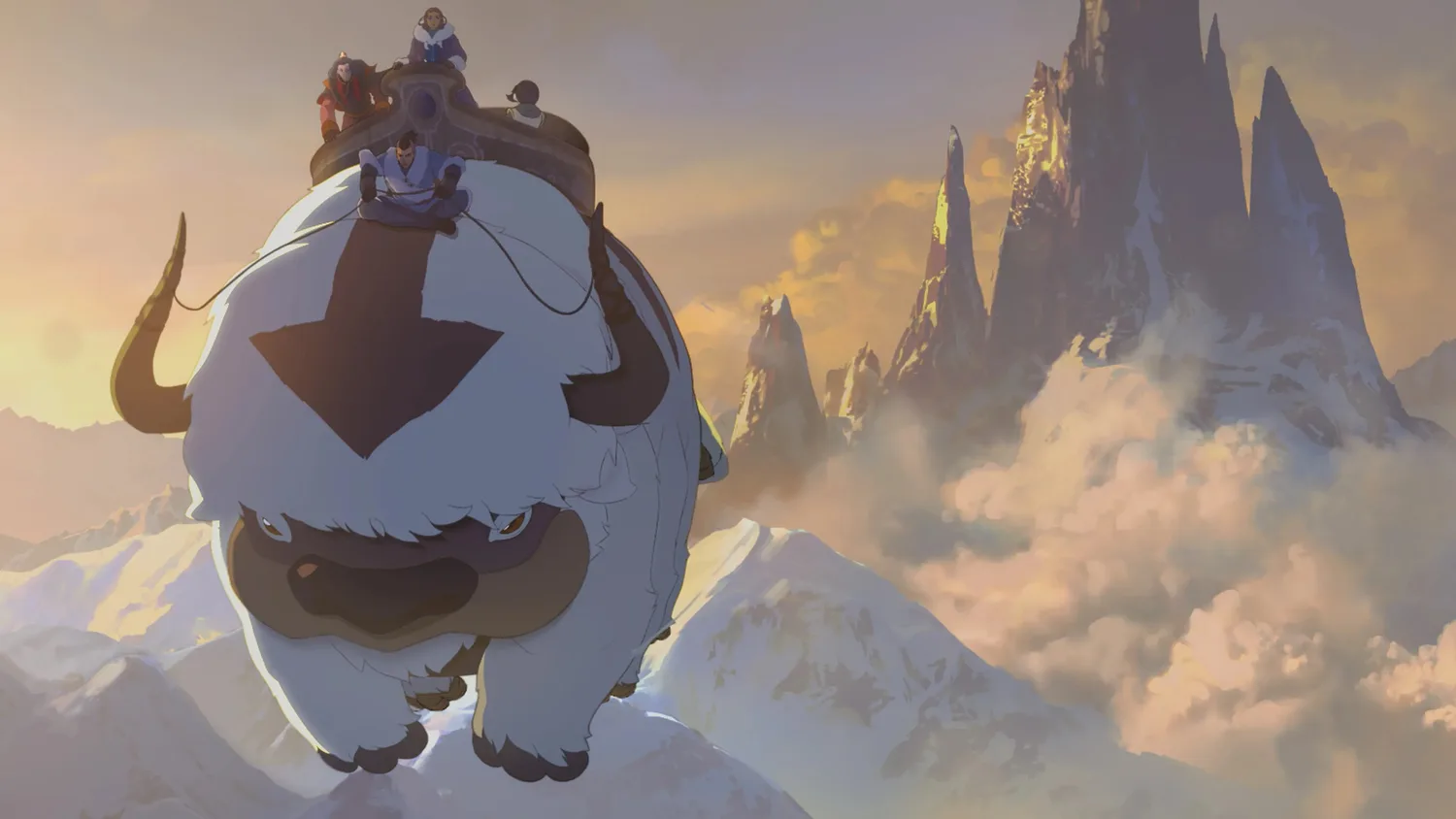 Appa sobrevuela las montañas con el grupo a bordo en la película Avatar Aang