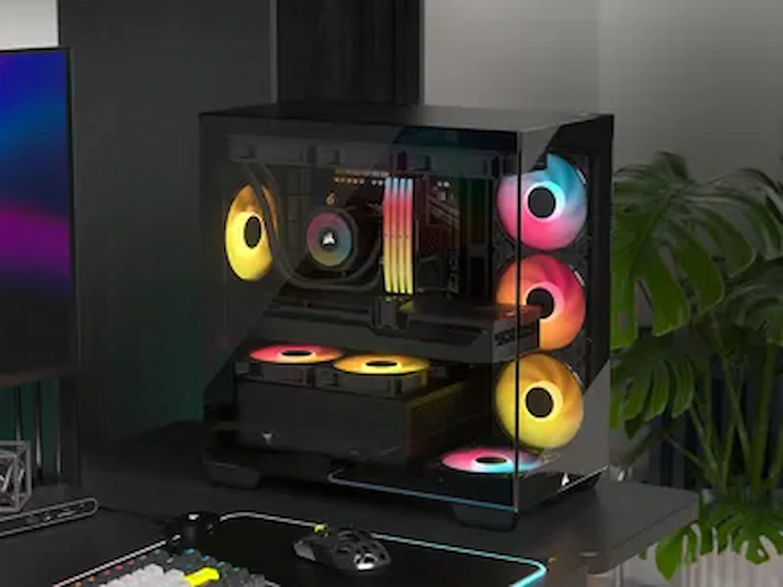 El gabinete Corsair 2800X RS-R ARGB armado en un escritorio gamer, mostrando la placa de video a través del panel de vidrio