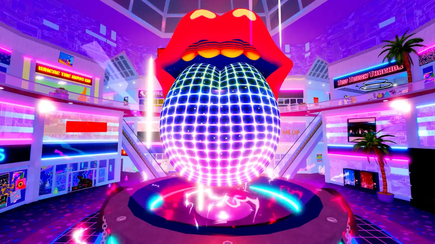 Otra vista de la lengua y labios gigantes de The Rolling Stones sobre una bola de disco, en una zona tipo shopping neón del juego en Roblox