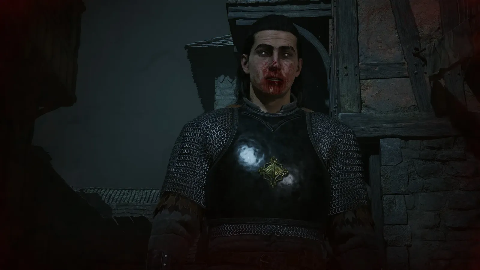 Primer plano de un personaje con el rostro ensangrentado y cota de malla en The Blood of Dawnwalker