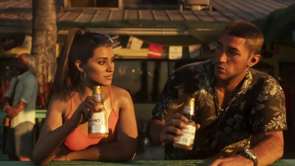 Jason y Lucia sentados con una cerveza cada uno en una escena de GTA 6