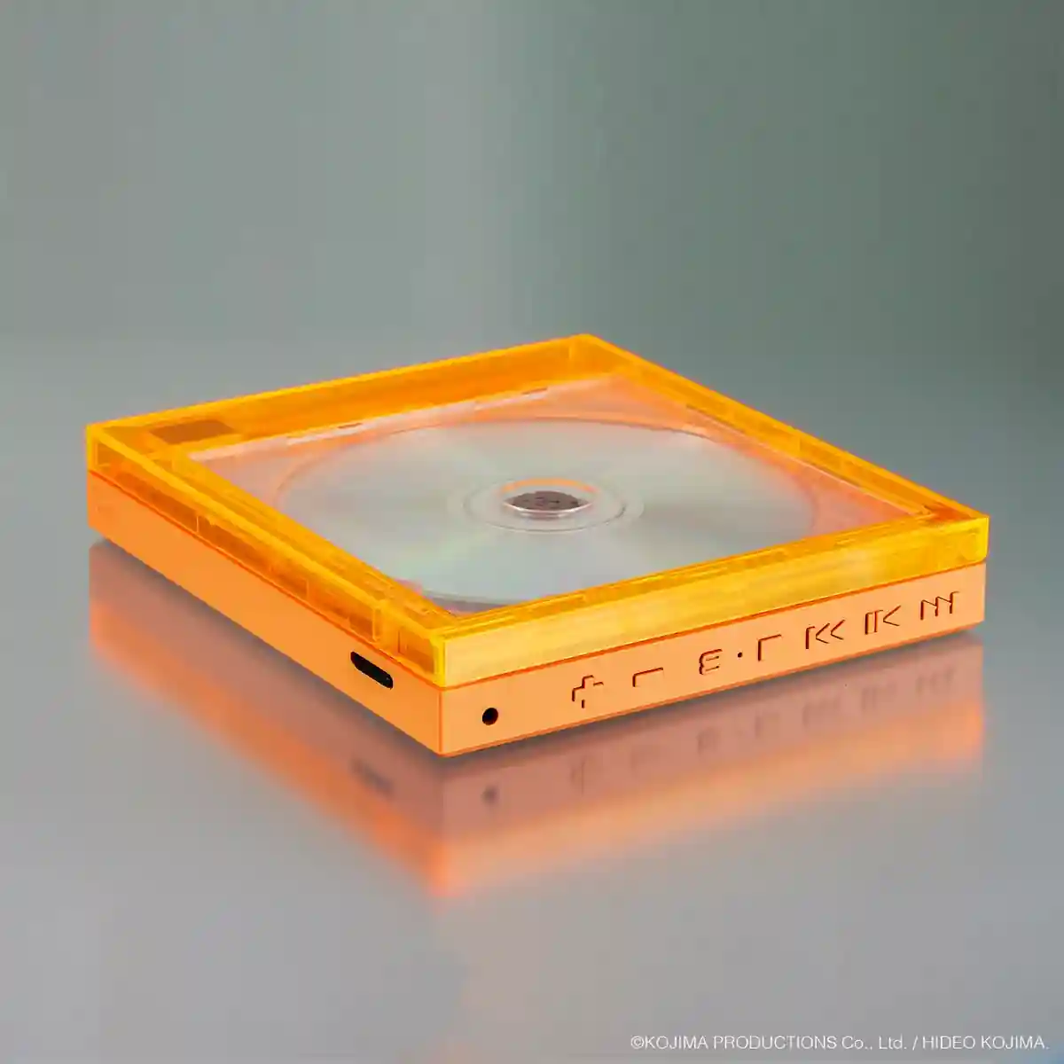Discman Instant Disc Audio CP1 de Death Stranding 2, con carcasa transparente naranja