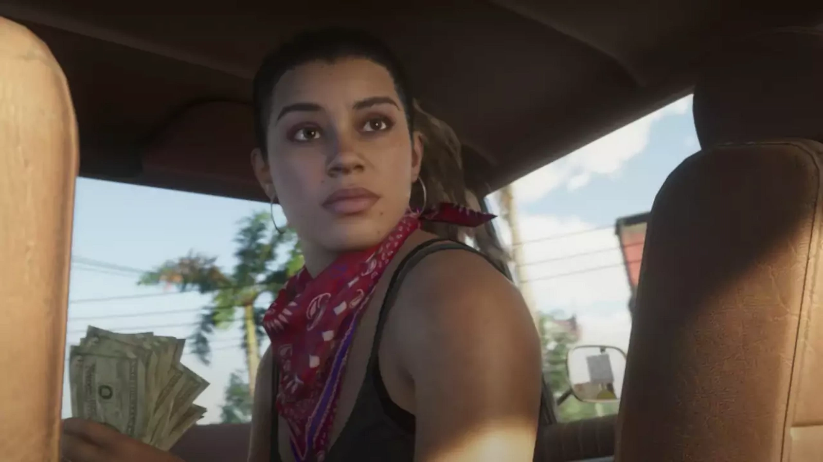 Lucia, protagonista de GTA 6, sentada en un auto con dinero en la mano