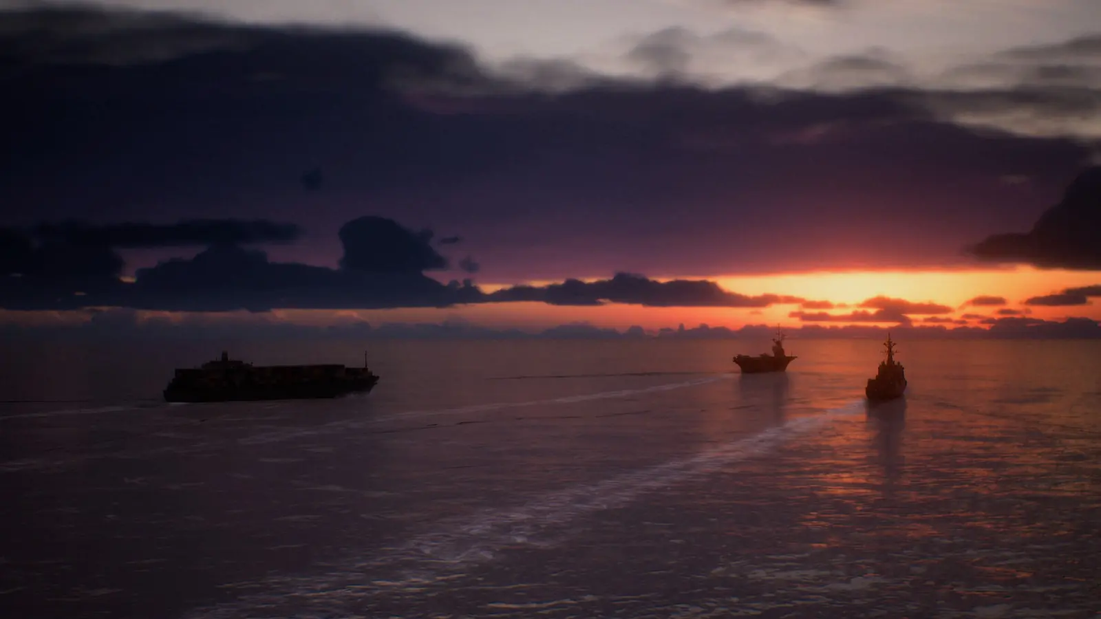 Buques de guerra recortados contra el atardecer