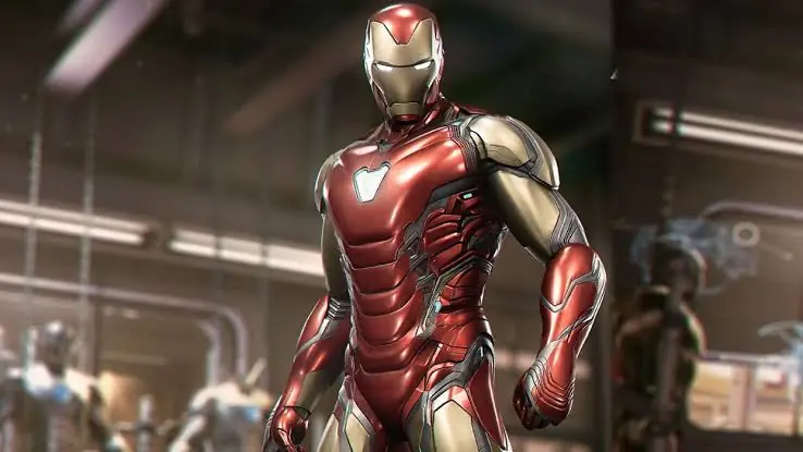 Otra imagen del juego de Iron Man de EA Motive: la armadura dentro de un taller con brazos robóticos