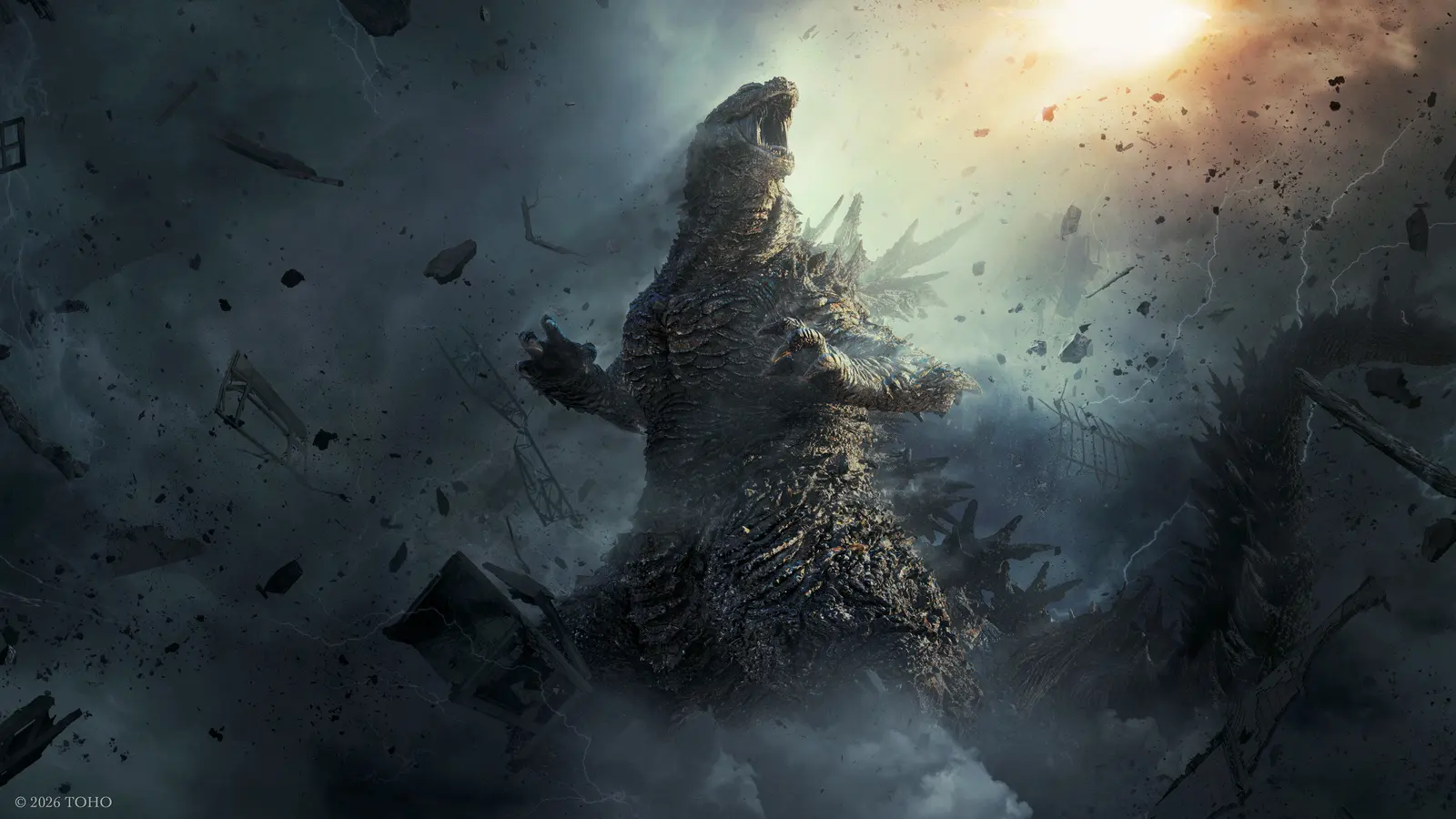 Godzilla rugiendo entre escombros que vuelan por el aire, en el arte promocional de Godzilla Minus Zero