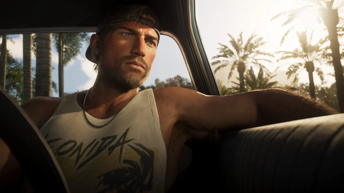 Jason Duval al volante de un auto en GTA 6, con gorra y palmeras de Leonida de fondo