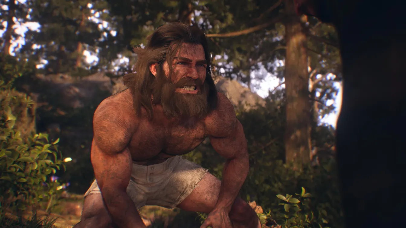 Logan en estado salvaje, barbudo y sin remera, en un bosque de Marvel’s Wolverine