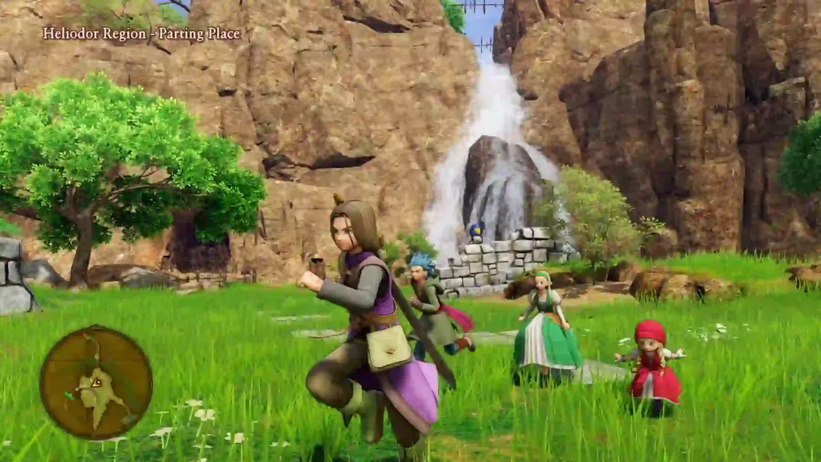 Exploración en 3D de Dragon Quest XI S en Switch 2: el héroe y su equipo frente a una cascada
