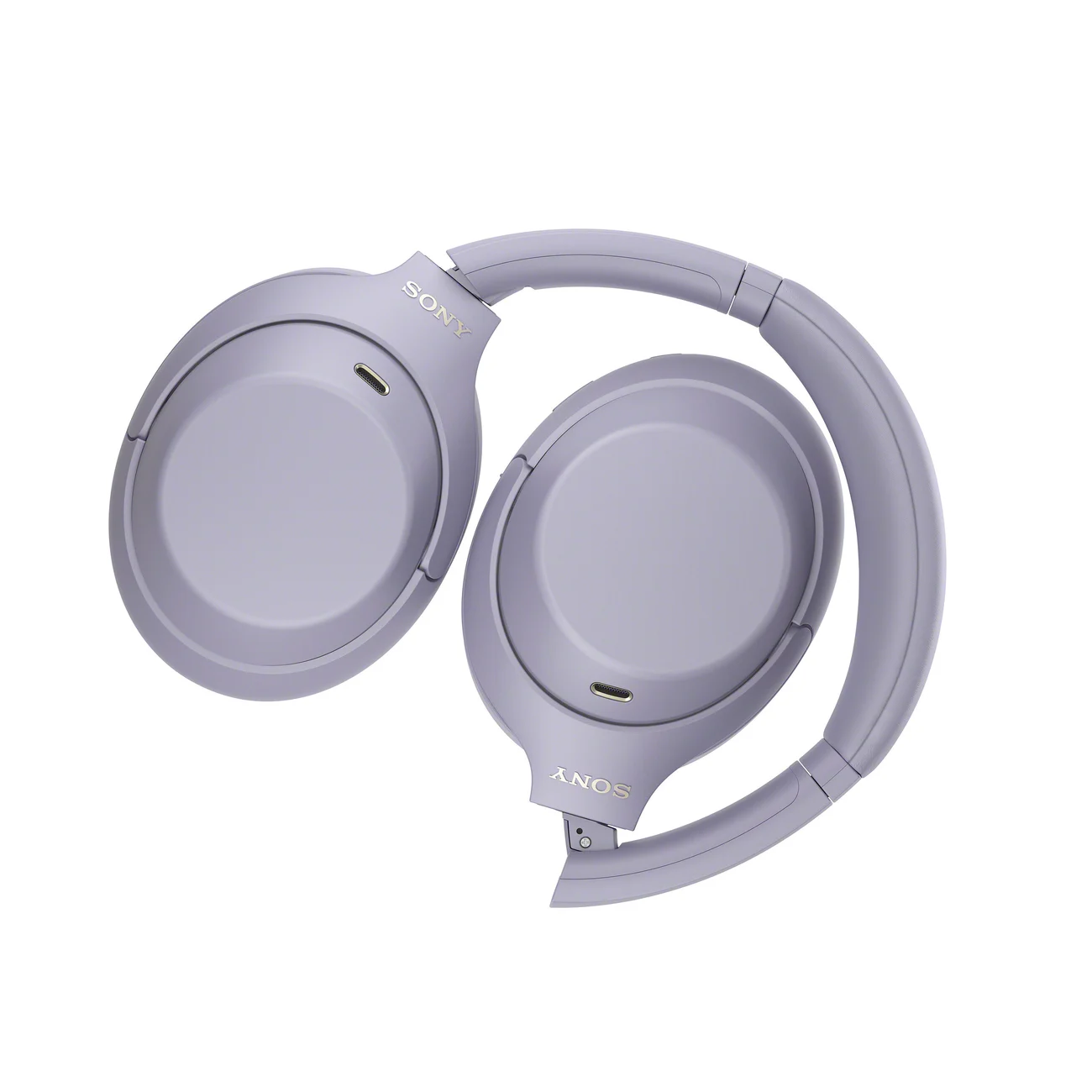 Auriculares Sony WH-1000XM4C en color lavanda, plegados sobre fondo blanco