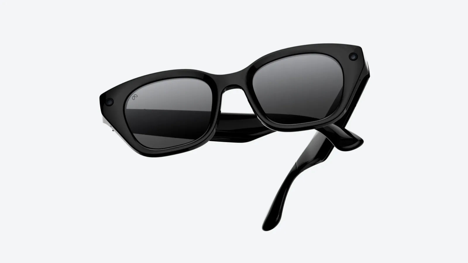 Lentes inteligentes negros con cámara y luz LED en las esquinas del marco, sobre fondo blanco