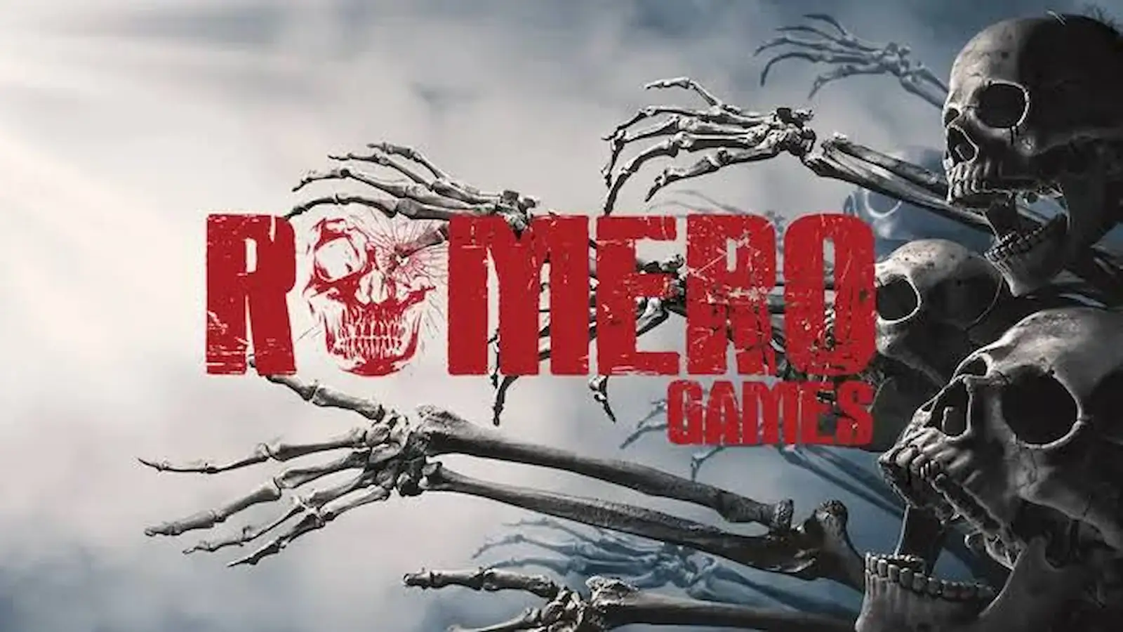 Logo de Romero Games, el estudio de John Romero, sobre un fondo de esqueletos