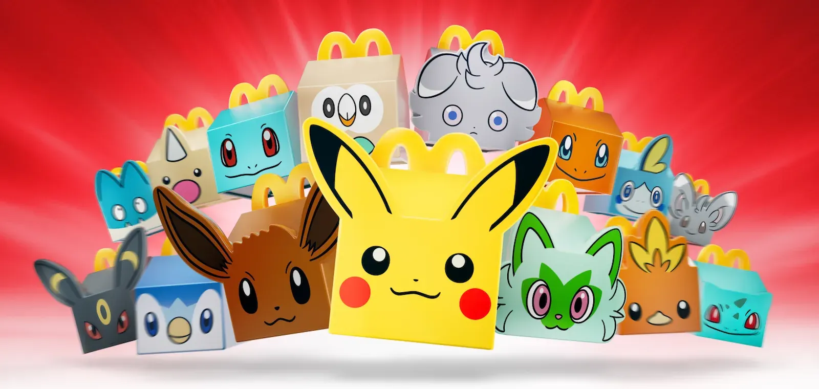 Los juguetes con forma de Cajita Feliz de Pokémon: Pikachu, Eevee, Sprigatito, Umbreon, Piplup y otros, en el arte oficial de McDonald’s